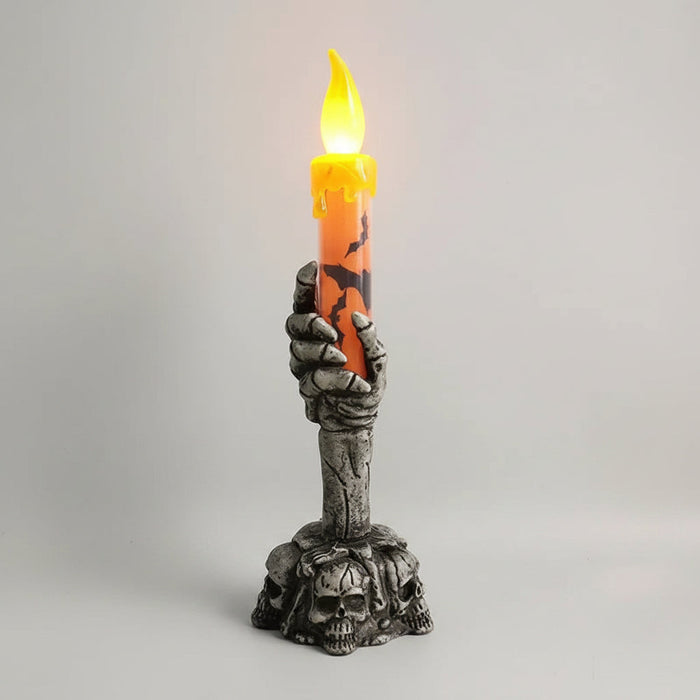 Świeca LED na Halloween z motywem szkielety, w kolorach pomarańczowym i zielonym, o wysokości  1